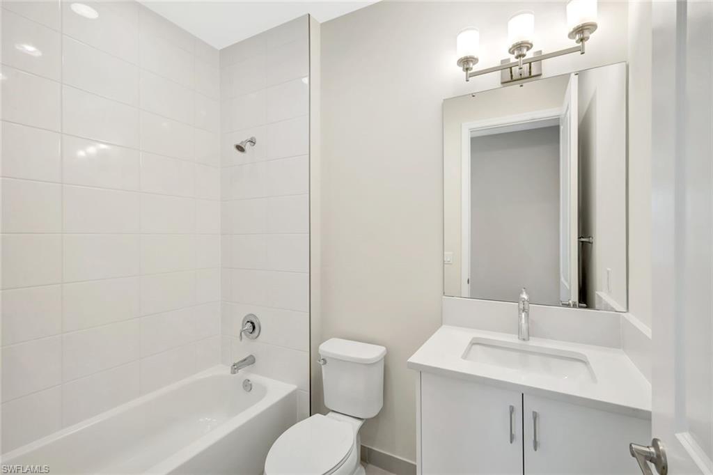 21023 Teak Tree Terrace Estero, FL 33928 - Photo 17 of 21 a bathroom with a sink a toilet and shower