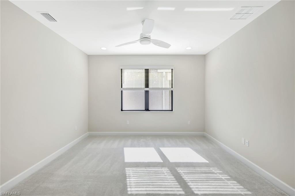 21023 Teak Tree Terrace Estero, FL 33928 - Photo 18 of 21 an empty room with a window