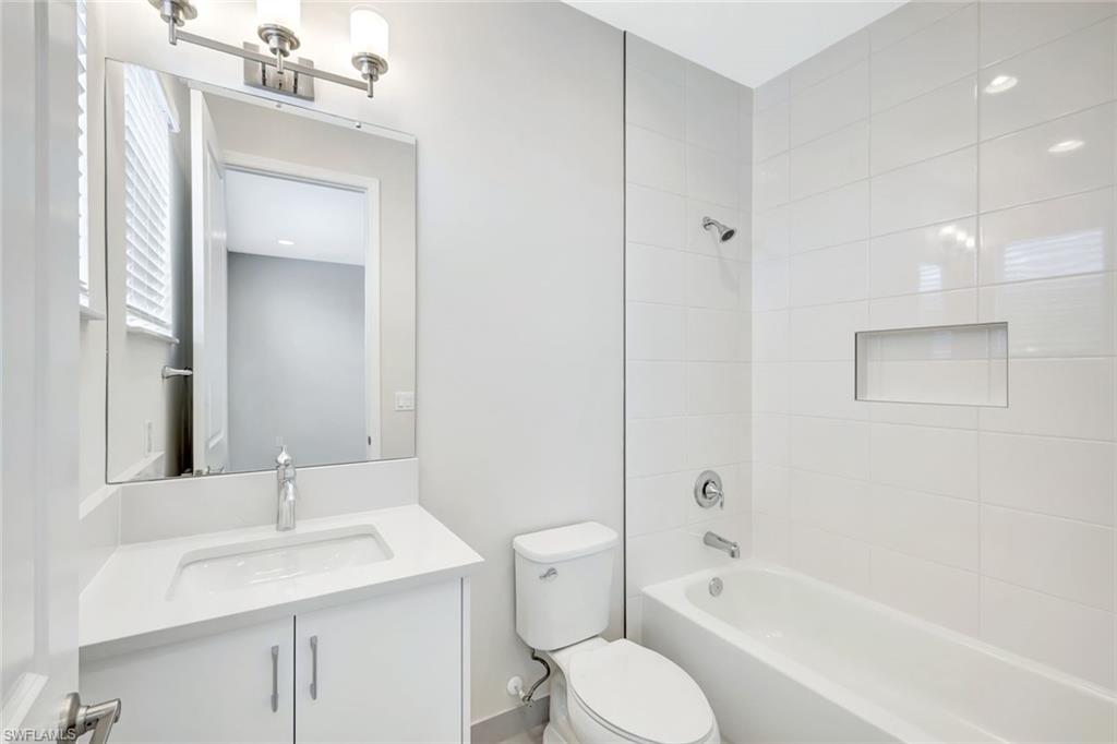 21023 Teak Tree Terrace Estero, FL 33928 - Photo 19 of 21 a bathroom with a granite countertop sink toilet and shower