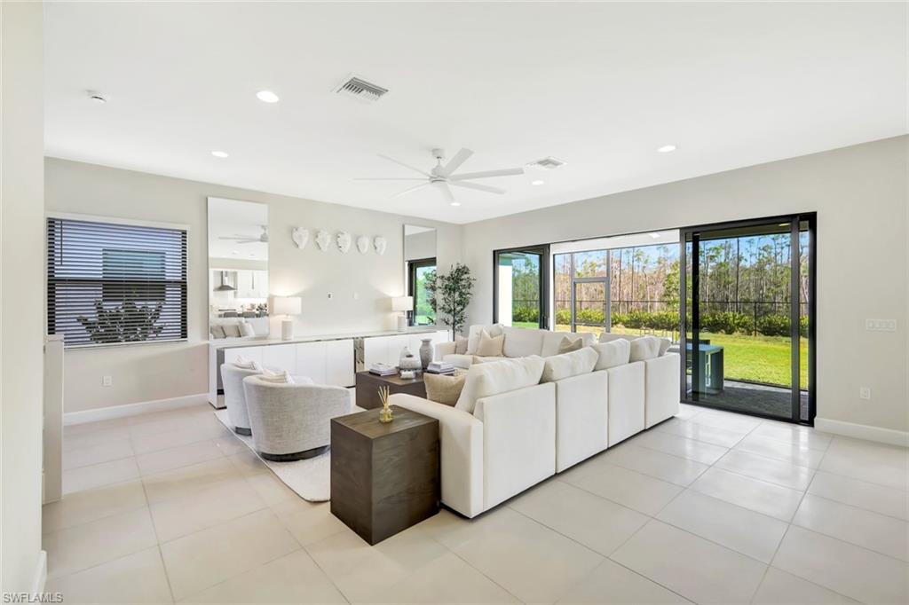 21023 Teak Tree Terrace Estero, FL 33928 - Photo 3 of 21 a living room with furniture and a large window