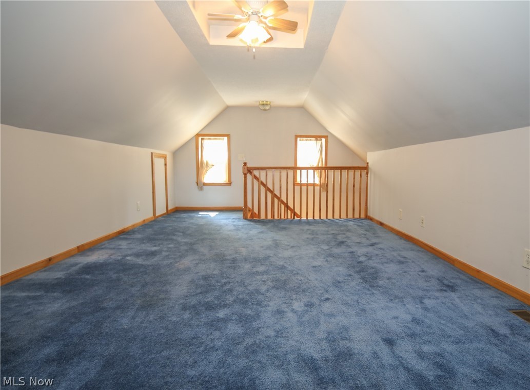 38610 Spiedel Town Road Bethesda, OH 43719 - Photo 30 of 33 Additional living space featuring carpet flooring, lofted ceiling, and ceiling fan