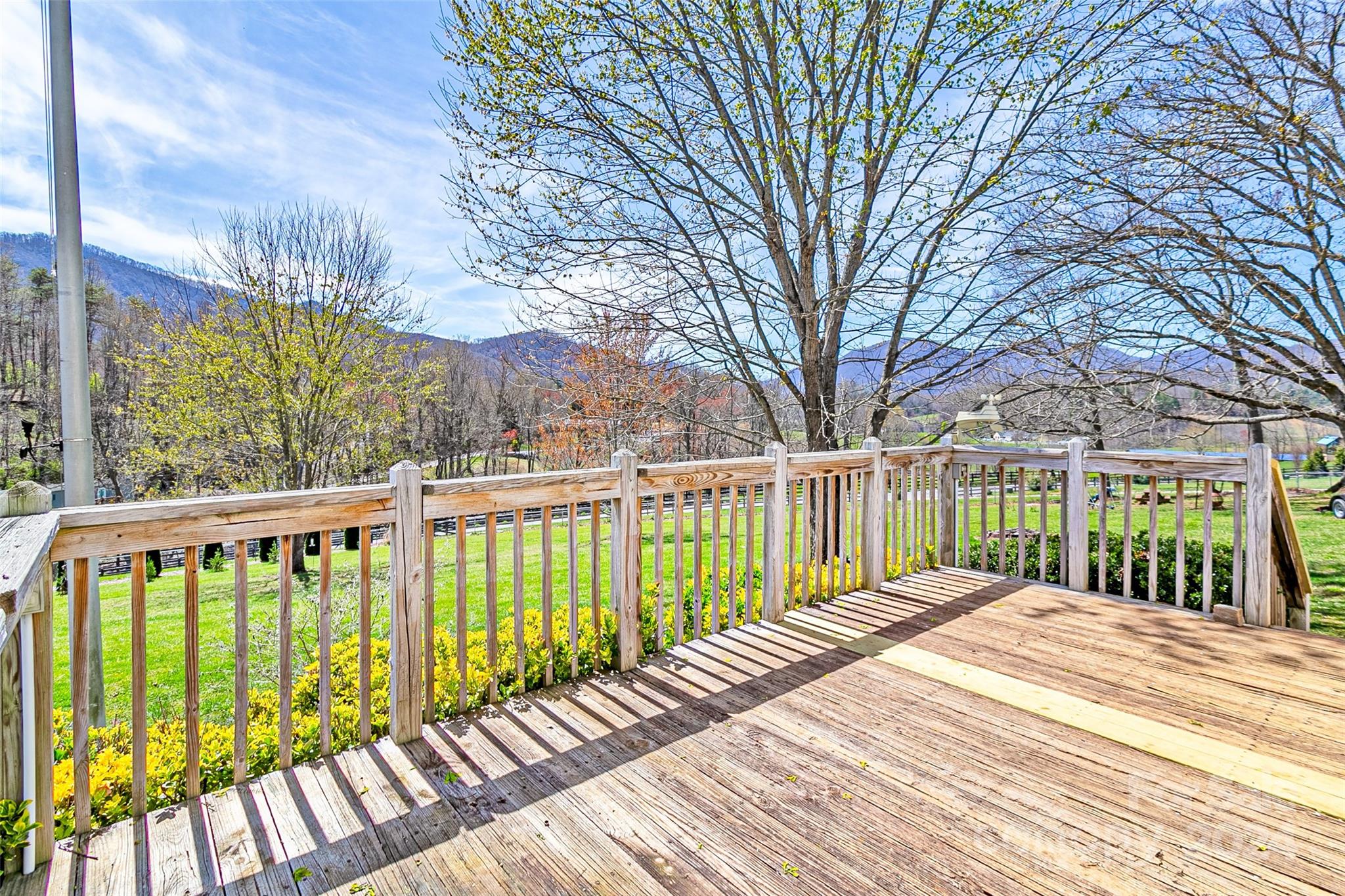 687 Newfound Road Leicester, NC 28748 - Photo 24 of 43 a view of balcony with wooden floor and fence