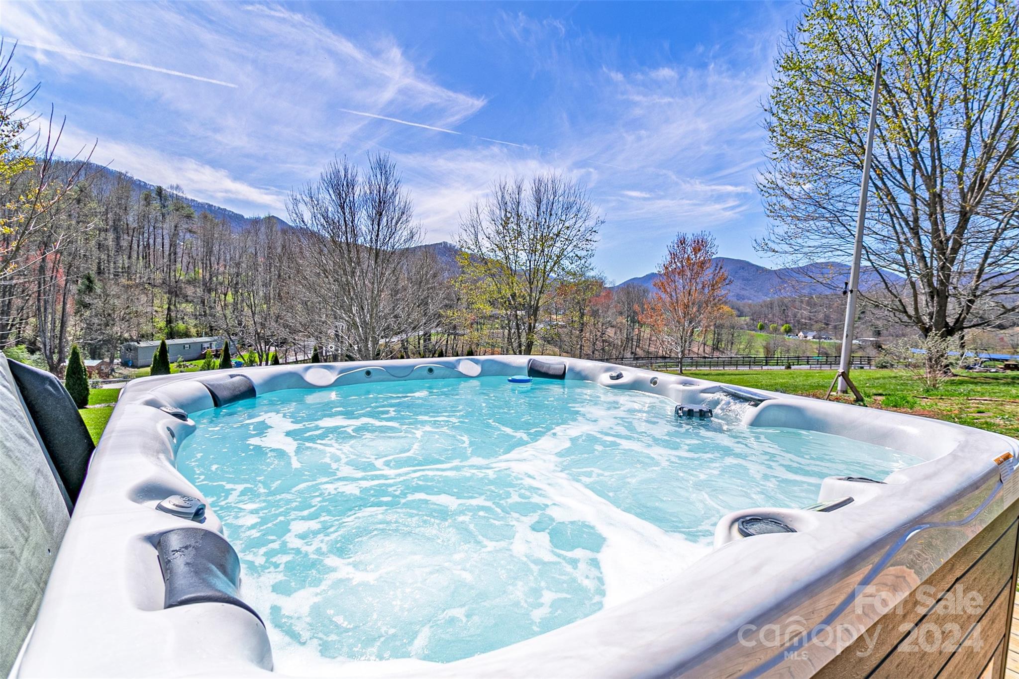 687 Newfound Road Leicester, NC 28748 - Photo 27 of 43 a view of a swimming pool with a patio