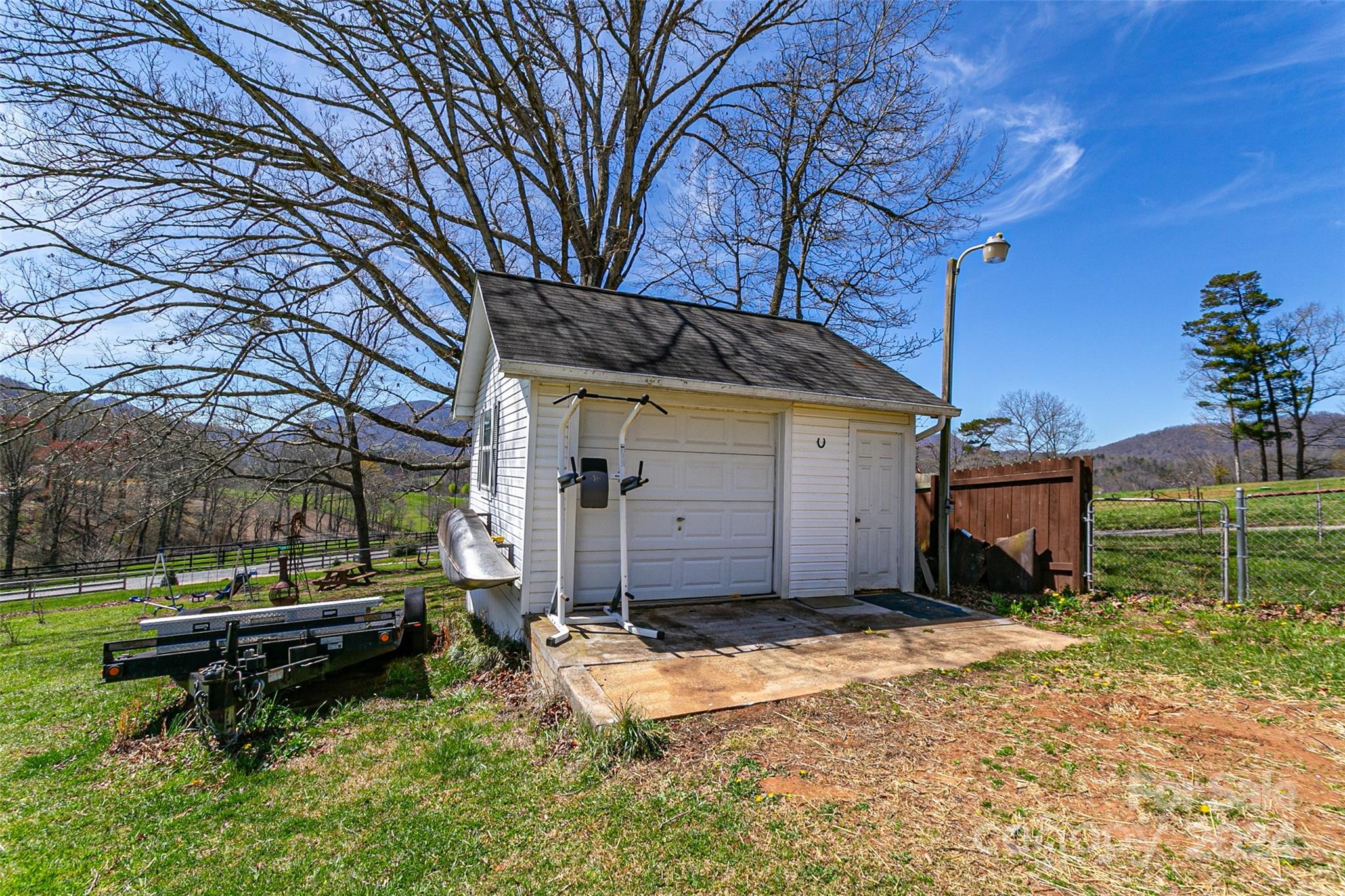 687 Newfound Road Leicester, NC 28748 - Photo 33 of 43 a backyard of a house with table and chairs