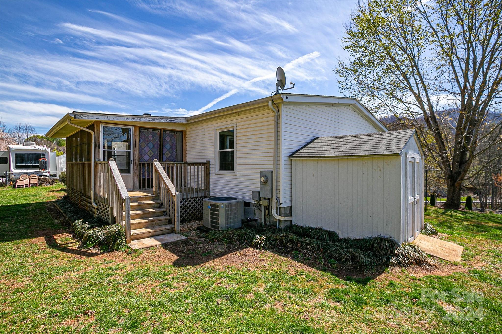 687 Newfound Road Leicester, NC 28748 - Photo 37 of 43 a view of a backyard with plants and a patio