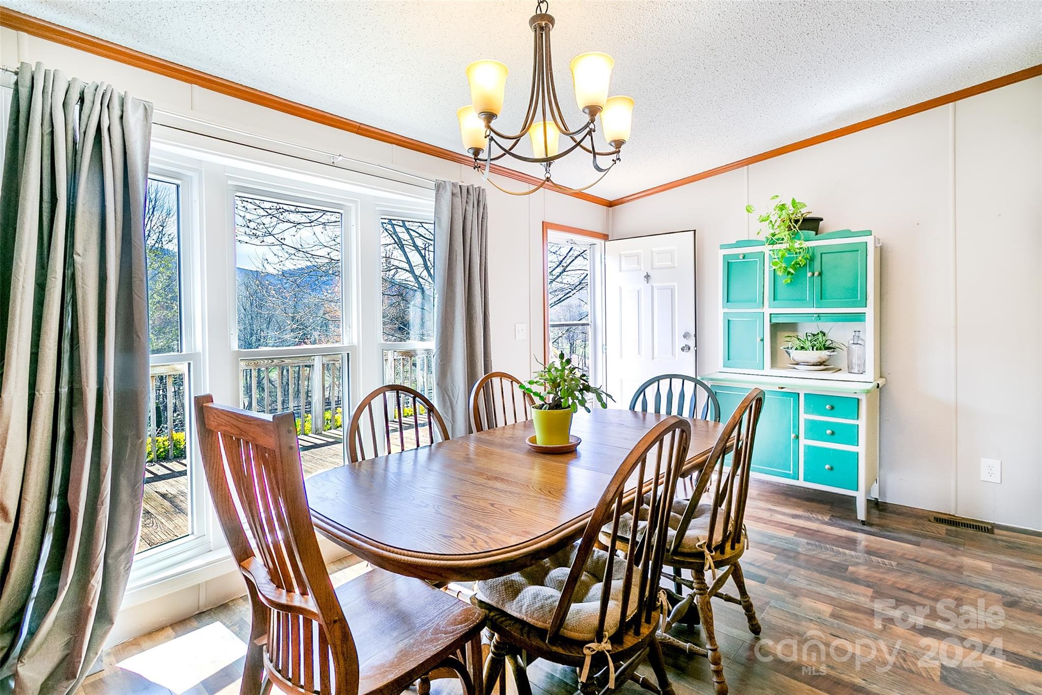687 Newfound Road Leicester, NC 28748 - Photo 6 of 43 a view of a dining room with furniture window and outside view