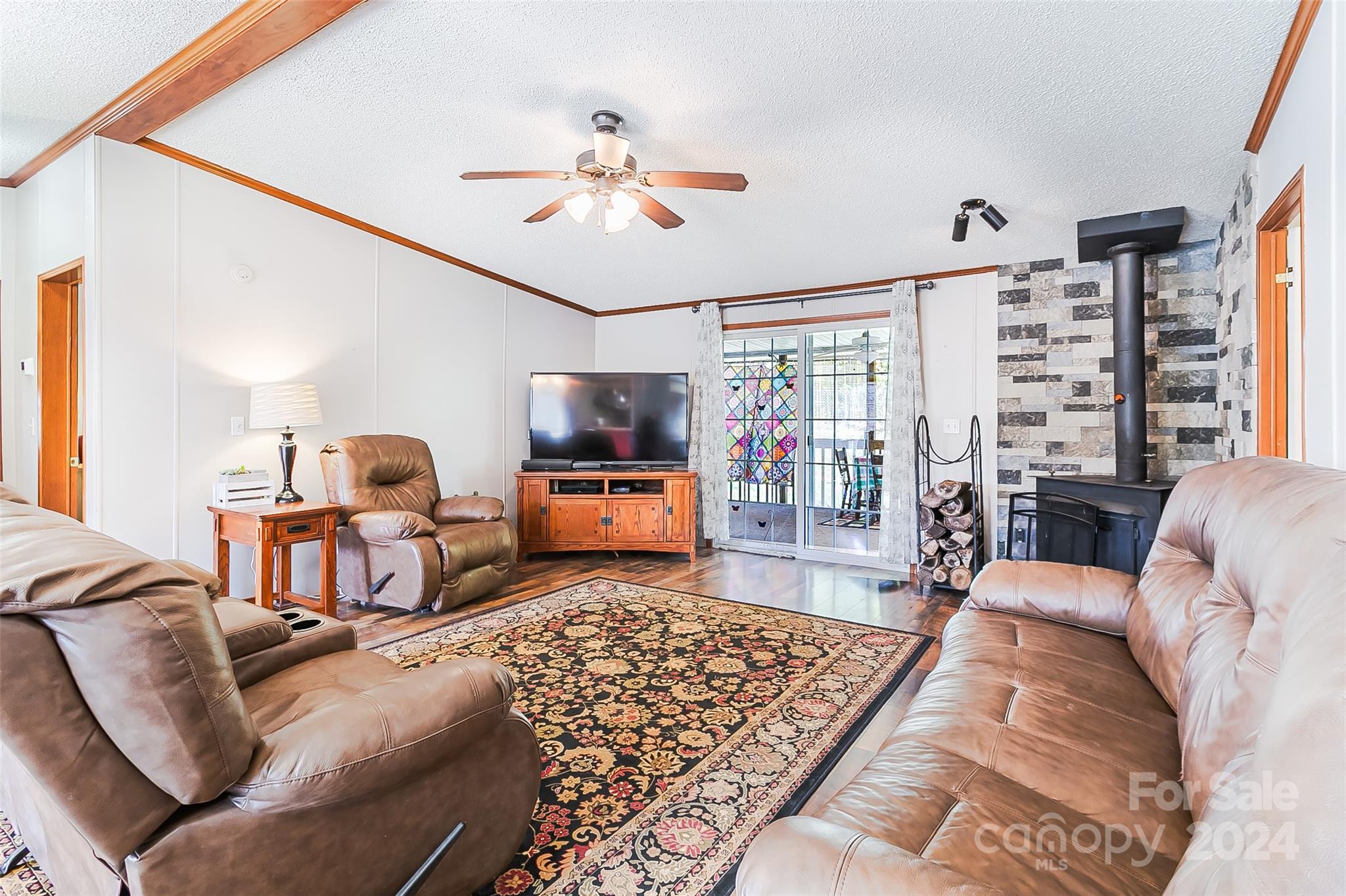 687 Newfound Road Leicester, NC 28748 - Photo 8 of 43 a living room with furniture or couch and a flat screen tv