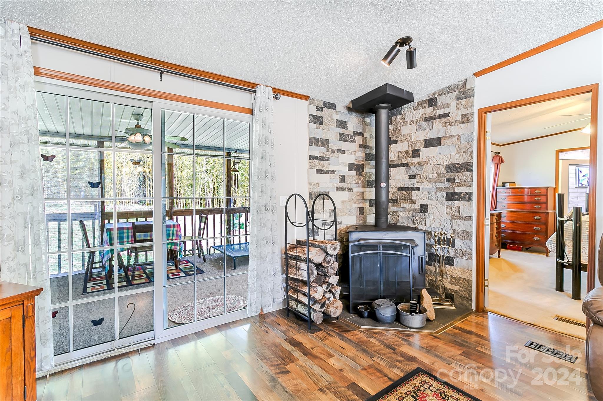 687 Newfound Road Leicester, NC 28748 - Photo 10 of 43 a view of workspace with wooden floor and windows