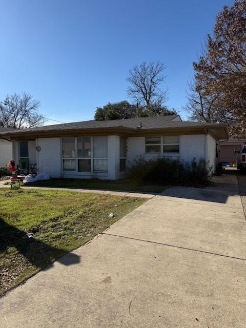 1915 North O'Connor Road Irving, TX 75061 - Photo 2 of 3 a view of a house with a yard