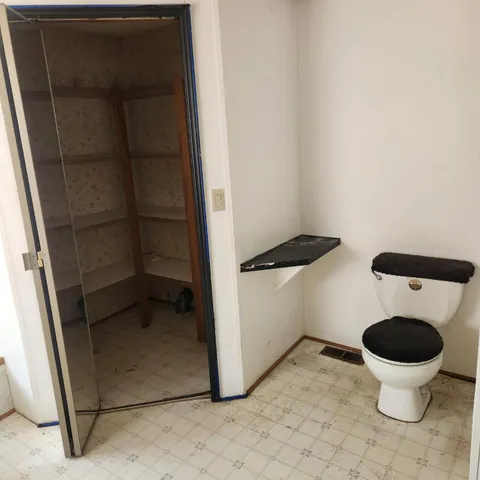 a view of a storage & utility room with a sink