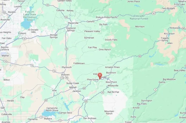 a white bath tub sitting next to a white wall