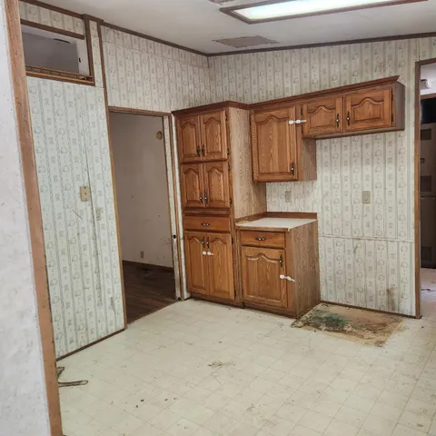 a kitchen with a sink and cabinets