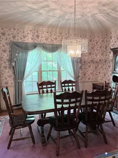 a view of a dinning table and chairs in the patio