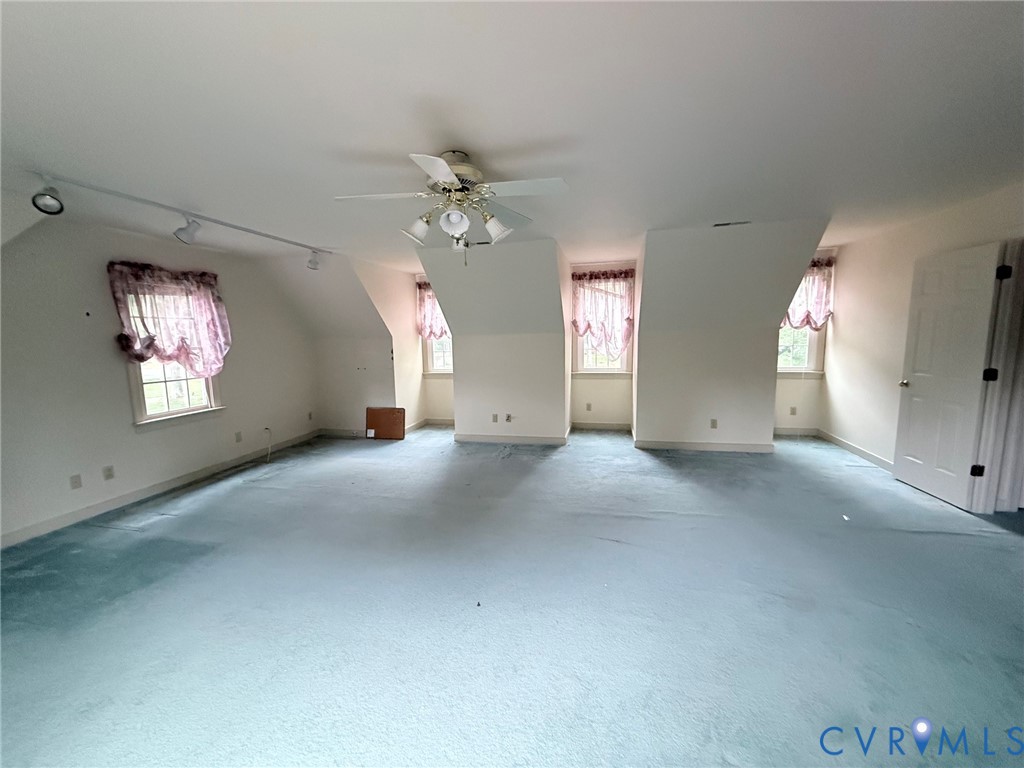 2301 Chartstone Drive Midlothian, VA 23113 - Photo 8 of 18 an empty room with windows and fan