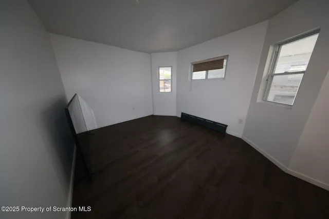 a bathroom with a sink toilet a mirror and shower