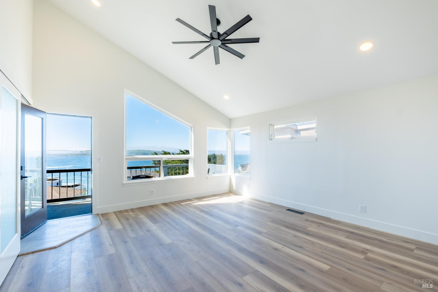 32 Kailua Way Dillon Beach, CA 94929 - Photo 11 of 19 wooden floor in an empty room with a window