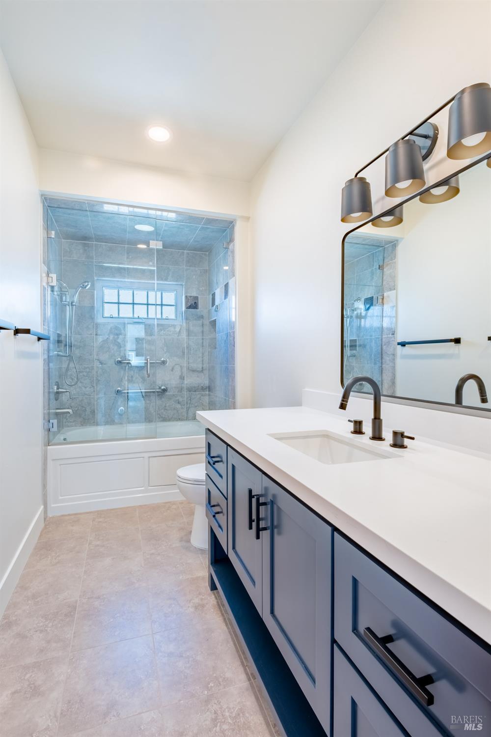 32 Kailua Way Dillon Beach, CA 94929 - Photo 14 of 19 a spacious bathroom with a sink and a mirror