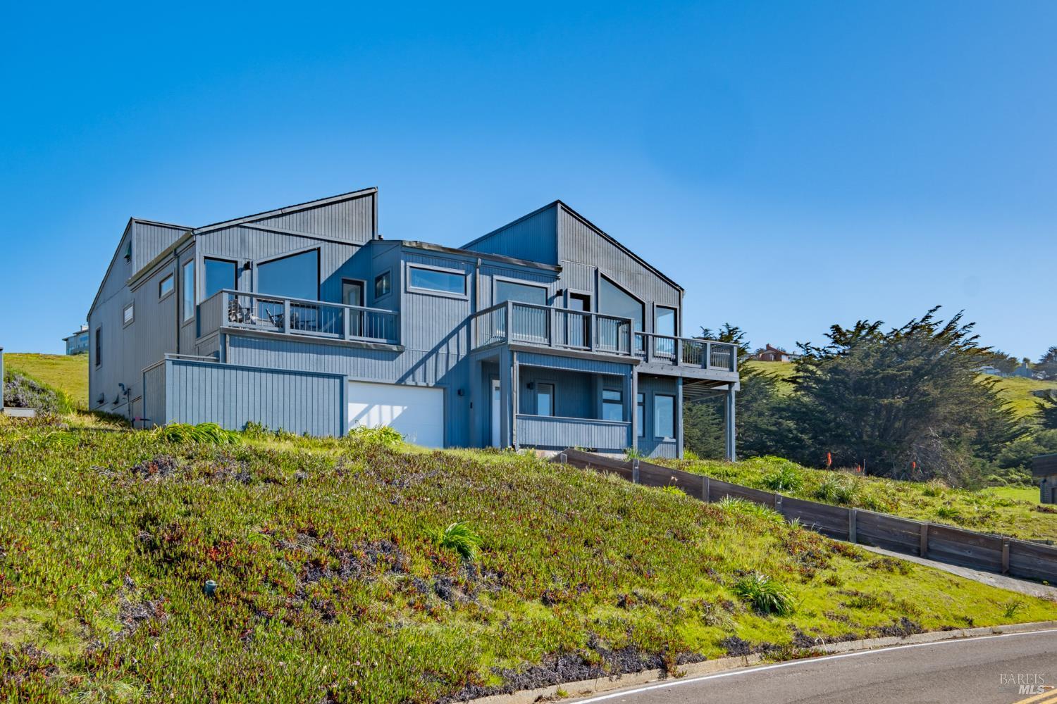32 Kailua Way Dillon Beach, CA 94929 - Photo 2 of 19 a front view of a house with a garden