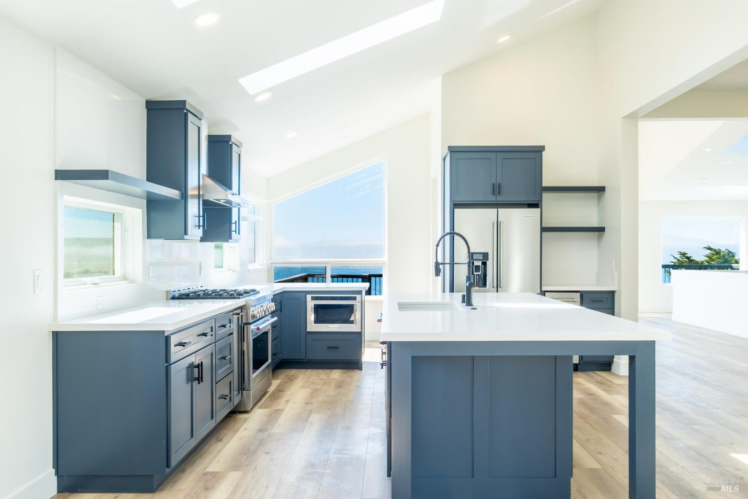 32 Kailua Way Dillon Beach, CA 94929 - Photo 10 of 19 a kitchen with a sink stove and refrigerator