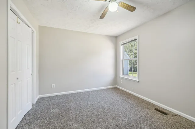 a bathroom with a sink toilet and a mirror