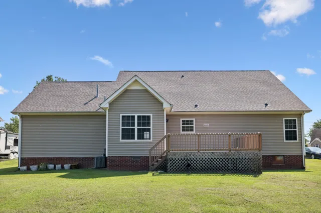 an aerial view of a house with a swimming pool