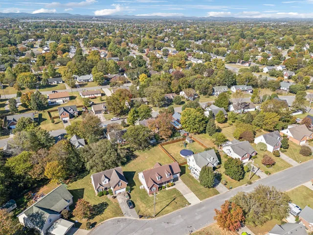 an aerial view of residential building with parking space