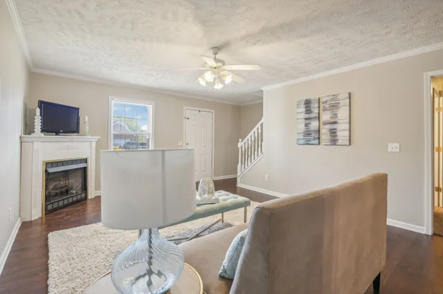 a living room with furniture and a fireplace
