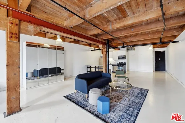 a living room with furniture and a rug