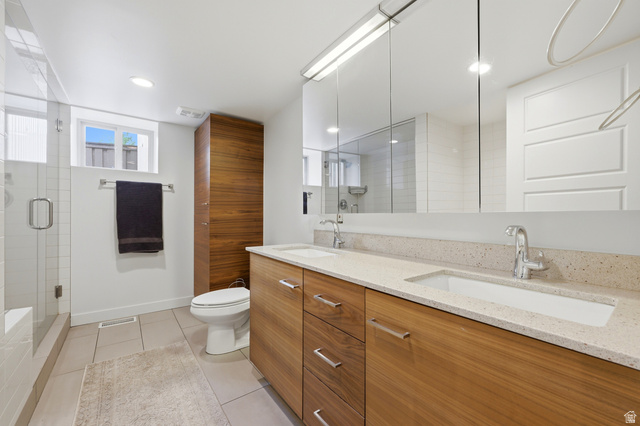 1389 Millbrook Way Bountiful, UT 84010 - Photo 52 of 74 Dual vanity with integrated sinks and chrome fixtures, set against a speckled light-toned countertop