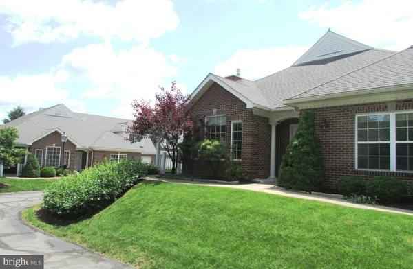 front view of a house and a yard
