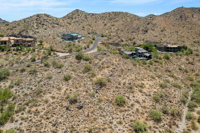 a view of a large mountain with a mountain in the background