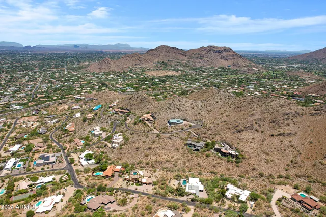 a view of a city with mountains in the background