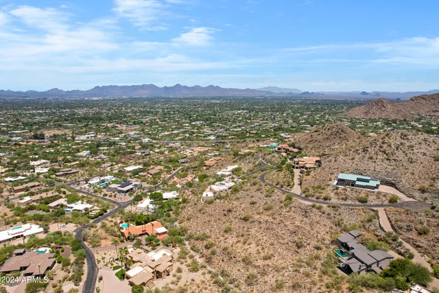 an aerial view of residential building and green space