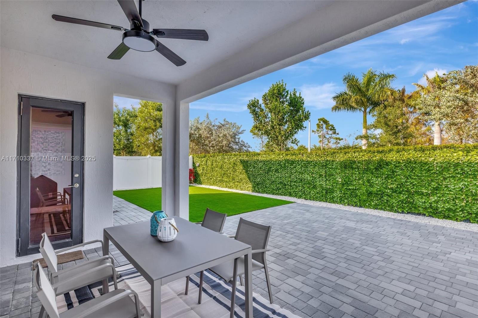 17473 Southwest 41st Street Miramar, FL 33029 - Photo 56 of 92 Large covered Patio / Expanded Pavers / artificial turf backyard