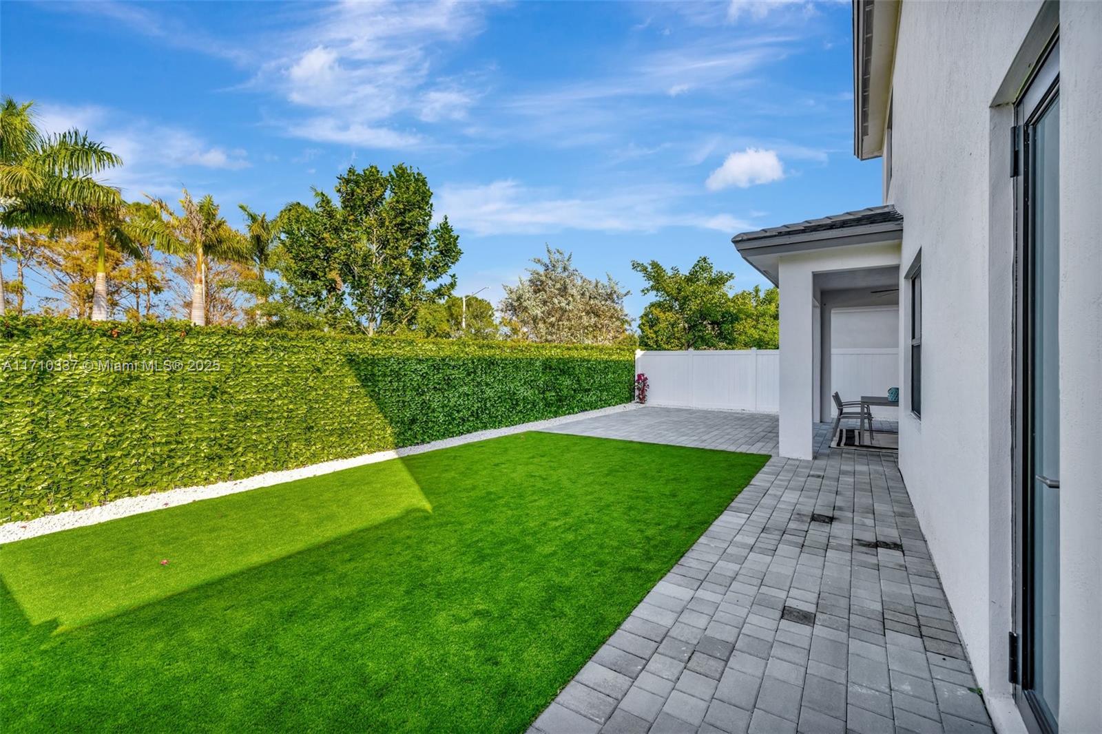17473 Southwest 41st Street Miramar, FL 33029 - Photo 59 of 92 Expanded Paver patio / artificial turf backyard