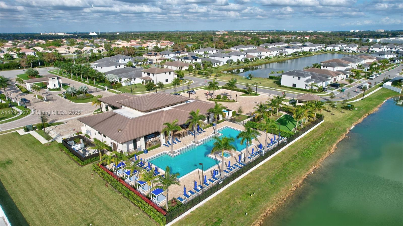 17473 Southwest 41st Street Miramar, FL 33029 - Photo 62 of 92 Brand New Luxury Clubhouse w/ Heated Lake Side Lap Pool with umbrellas and lounge chairs, Putting Green, Gym, Kitchen, Child Play Area and Party Spaces