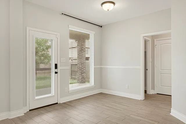 a kitchen with kitchen island granite countertop a sink cabinets and stainless steel appliances