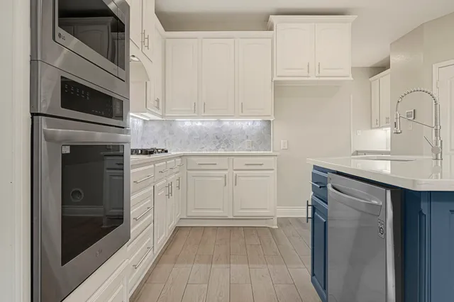 a kitchen with cabinets and window