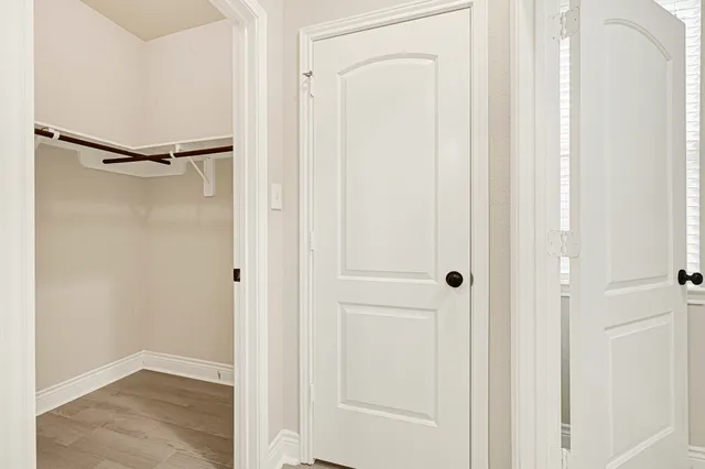 a view of an empty room with a window