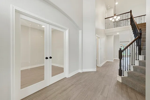 a view of wooden floor and windows in a room