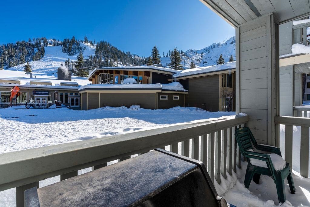 201 Shirley Cyn Road, Unit 714 Olympic Valley, CA 96146 - Photo 13 of 27 a view of a balcony with wooden chairs