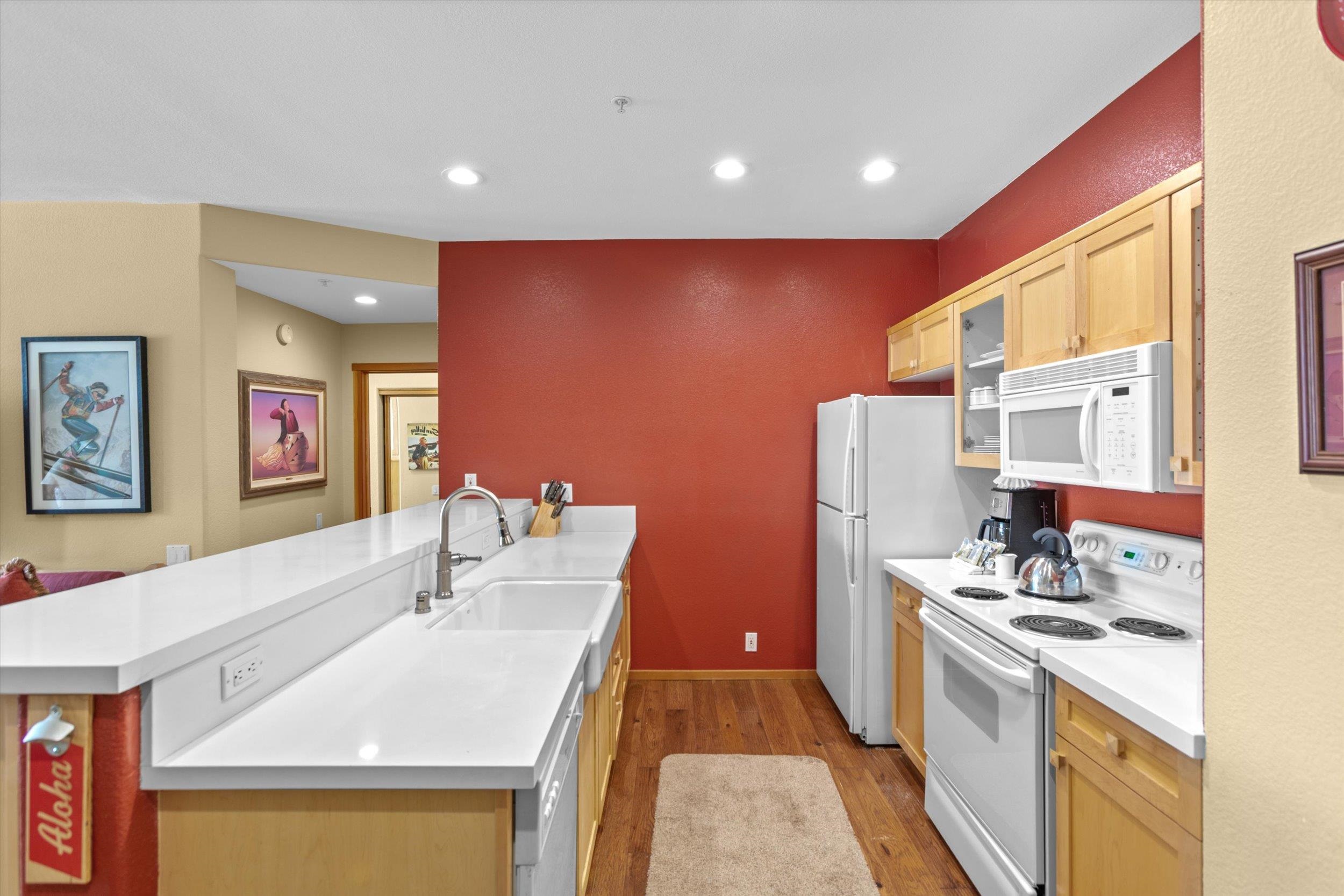 201 Shirley Cyn Road, Unit 714 Olympic Valley, CA 96146 - Photo 4 of 27 a kitchen with stainless steel appliances a sink a stove top oven a refrigerator and island