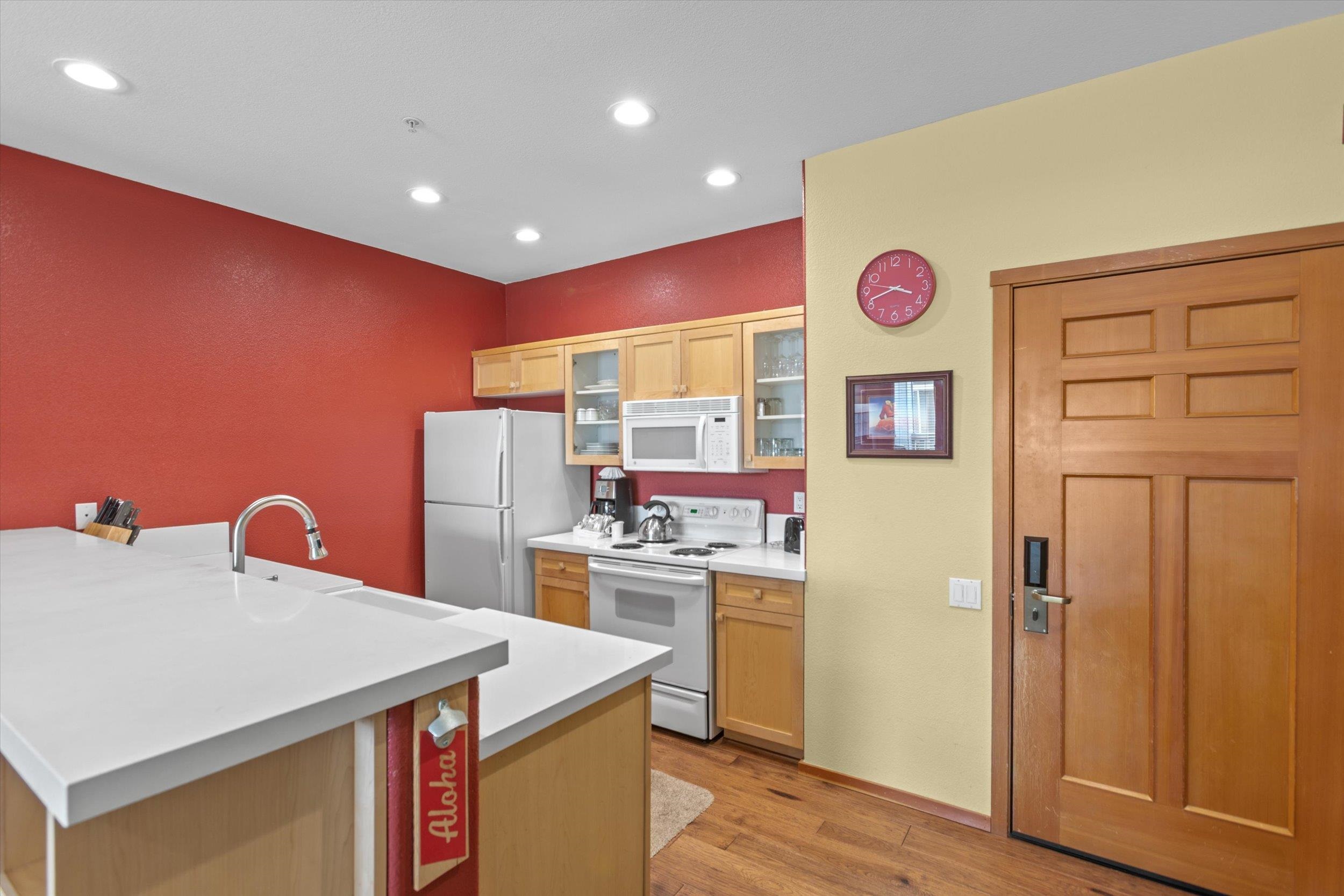 201 Shirley Cyn Road, Unit 714 Olympic Valley, CA 96146 - Photo 5 of 27 a kitchen that has a lot of cabinets and wooden floor