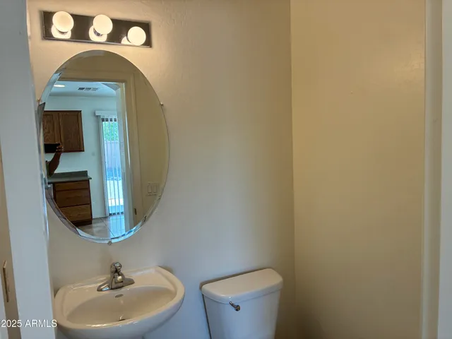 a bathroom with a toilet and a sink