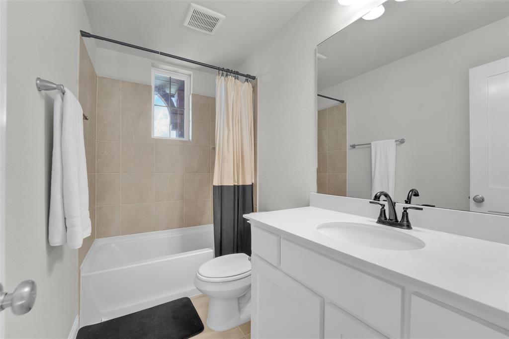 3520 Helios Lane Corinth, TX 76208 - Photo 26 of 37 Bathroom with white vanity, integrated sink, and black-finish faucet
