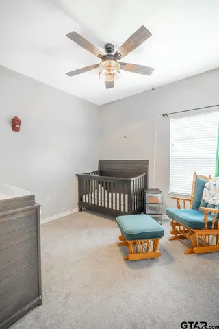a bedroom with furniture and a window