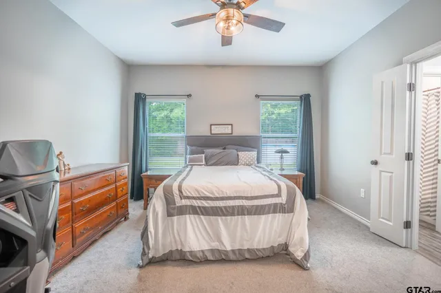 a bed room with a bed and a chandelier