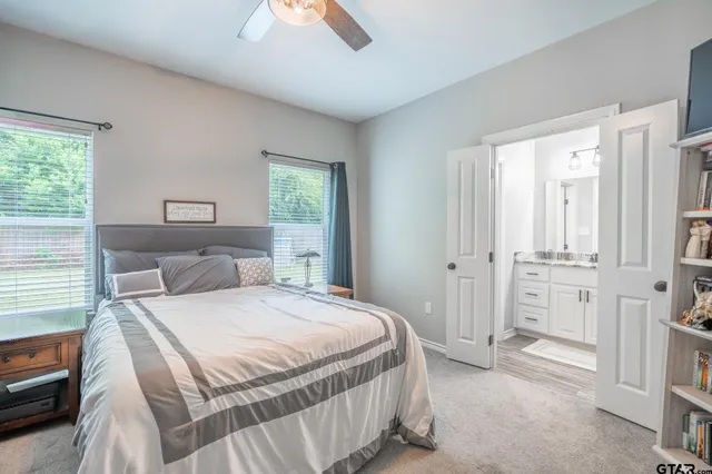 a bedroom with a bed and a couch