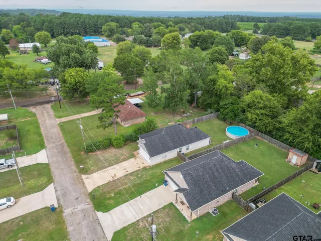 an aerial view of a house with a garden