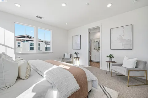 a bedroom with furniture and a window